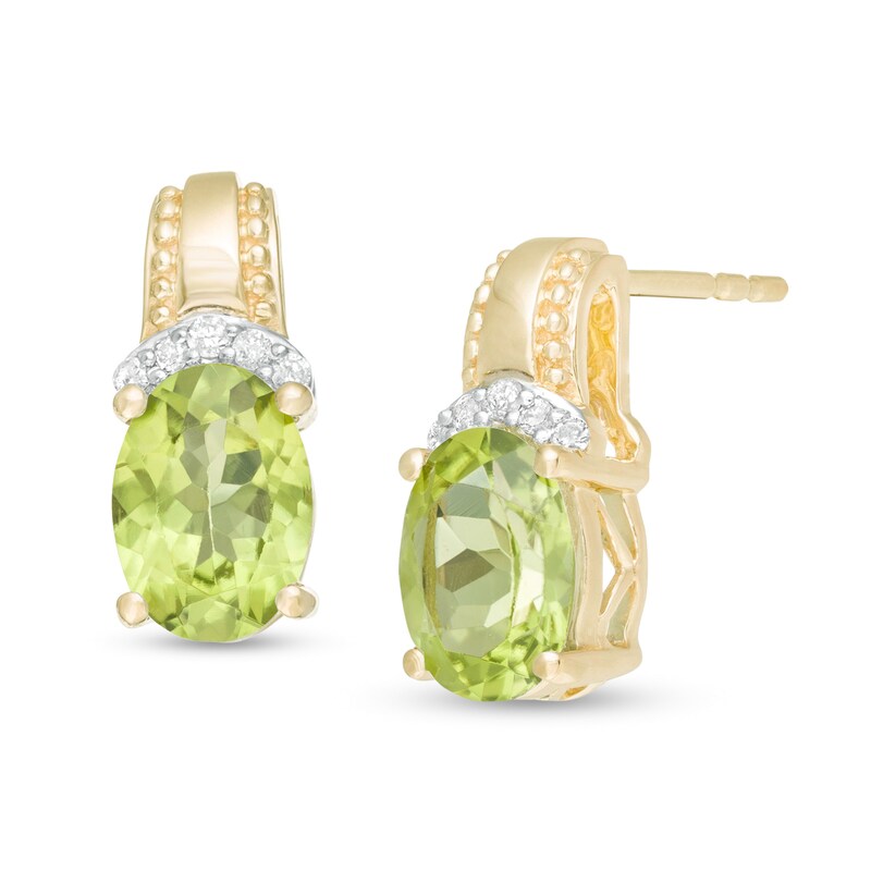 Main Image 1 of Oval Peridot and 1/20 CT. T.W. Diamond Beaded Drop Earrings in 10K Gold