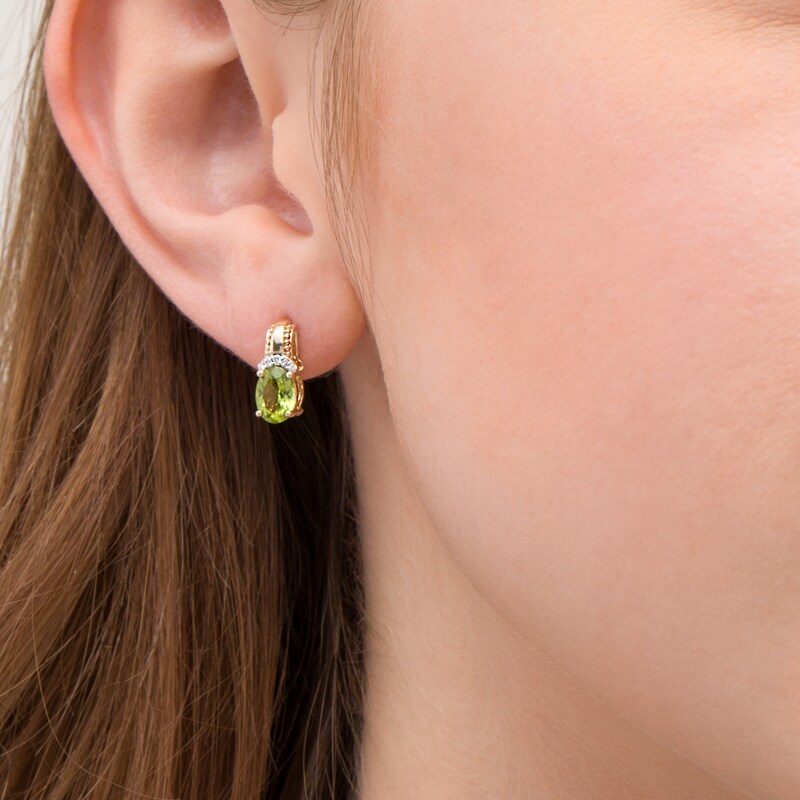 Main Image 2 of Oval Peridot and 1/20 CT. T.W. Diamond Beaded Drop Earrings in 10K Gold