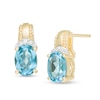Thumbnail Image 0 of Oval Swiss Blue Topaz and 1/20 CT. T.W. Diamond Beaded Drop Earrings in 10K Gold