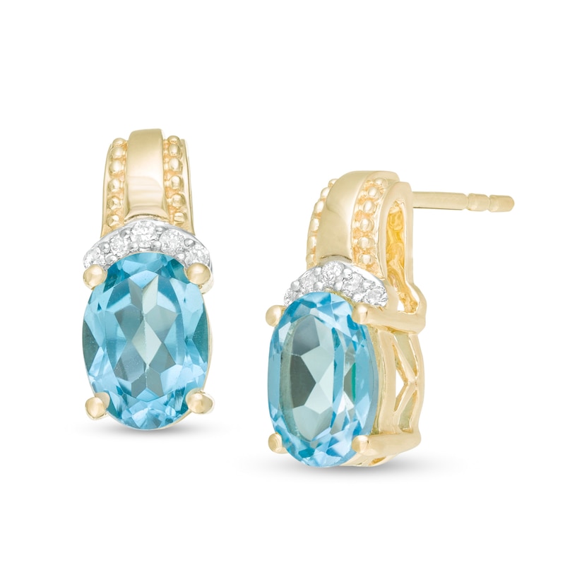 Oval Swiss Blue Topaz and 1/20 CT. T.W. Diamond Beaded Drop Earrings in 10K Gold