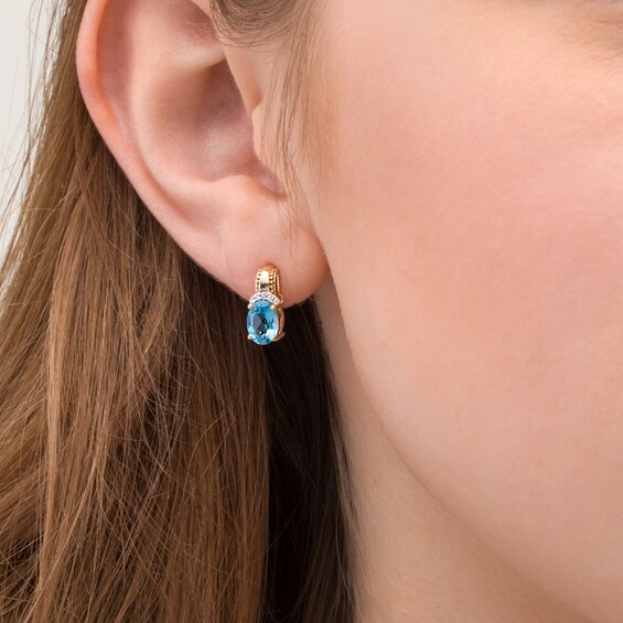 Oval Swiss Blue Topaz and 1/20 CT. T.w. Diamond Beaded Drop Earrings in 10K Gold