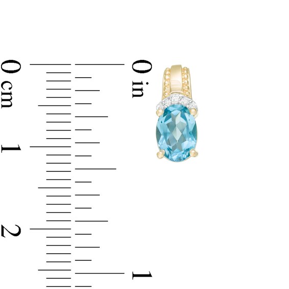 Oval Swiss Blue Topaz and 1/20 CT. T.w. Diamond Beaded Drop Earrings in 10K Gold