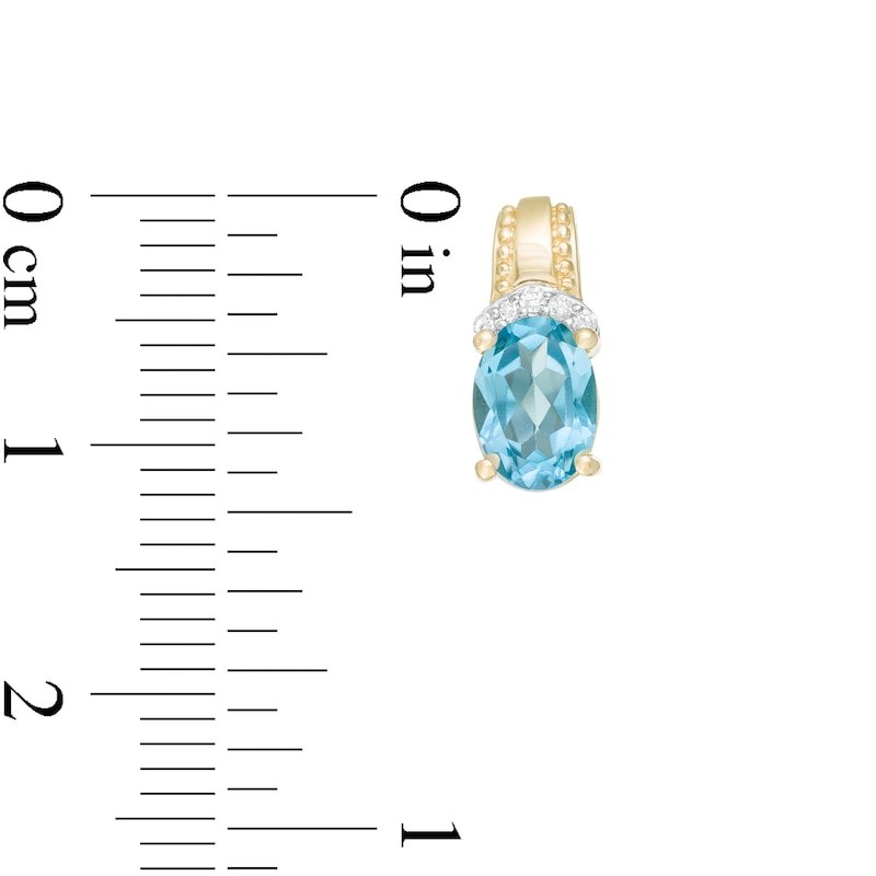 Main Image 3 of Oval Swiss Blue Topaz and 1/20 CT. T.W. Diamond Beaded Drop Earrings in 10K Gold