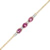Thumbnail Image 1 of Oval Rhodolite Garnet and 1/20 CT. T.W. Diamond Bracelet in 10K Gold - 7.5"