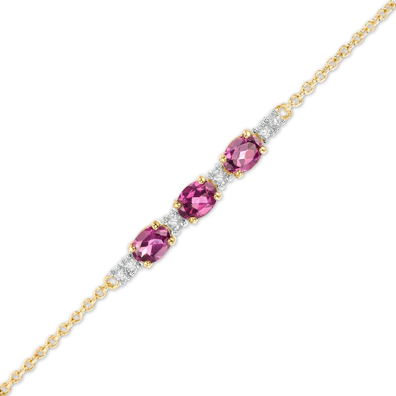 Main Image 1 of Oval Rhodolite Garnet and 1/20 CT. T.W. Diamond Bracelet in 10K Gold - 7.5"