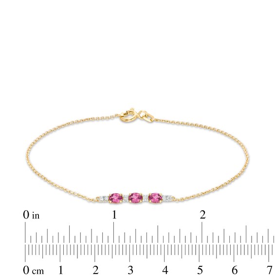 Oval Rhodolite Garnet and 1/20 CT. T.w. Diamond Bracelet in 10K Gold - 7.5"