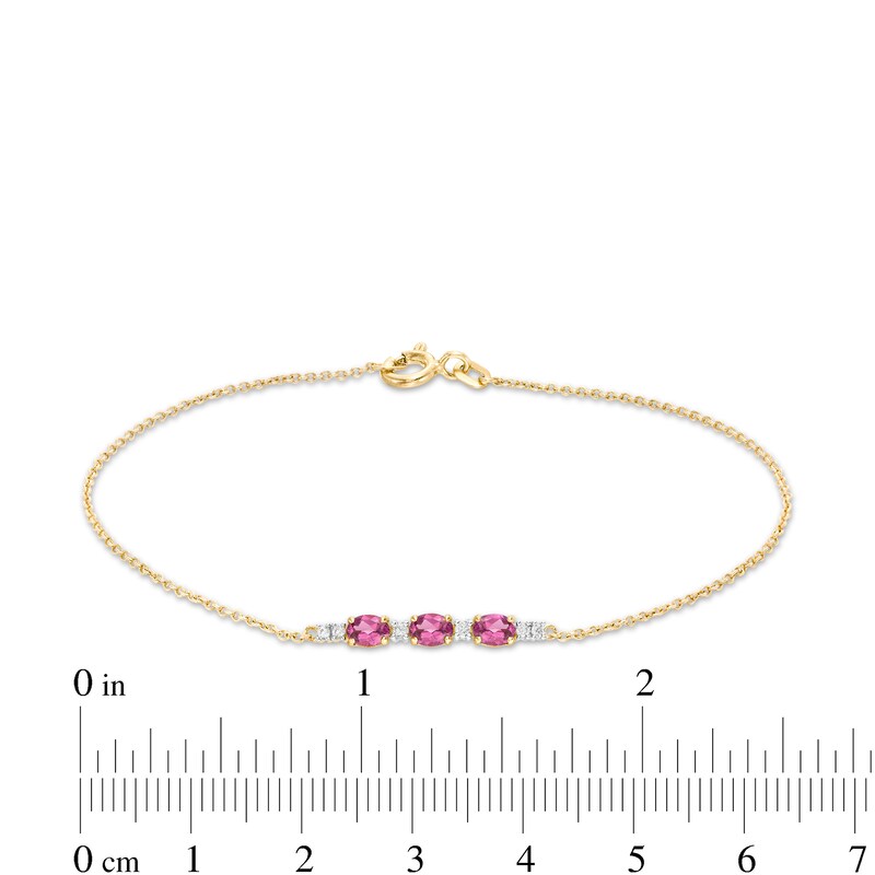 Main Image 4 of Oval Rhodolite Garnet and 1/20 CT. T.W. Diamond Bracelet in 10K Gold - 7.5"