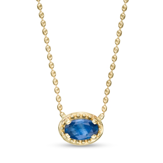 Sideways Oval Blue Sapphire Beaded Pendant in 10K Gold
