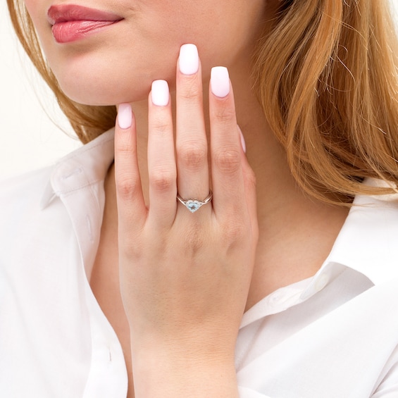 5.0mm Heart-Shaped Simulated Aquamarine and 0.067 CT. T.W. Diamond Frame Open Crossover Ring in 10K White Gold 5.0mm Heart-Shaped Simulated Aquamarine and 0.067 CT. T.W. Diamond Frame Open Crossover Ring in 10K White Gold
