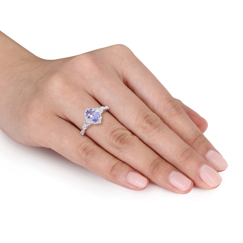 Oval Tanzanite, White Sapphire and 1/20 CT. T.W. Diamond Vintage-Style Ring in 14K White Gold