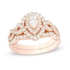 Thumbnail Image 1 of 1 CT. T.W. Pear-Shaped Diamond Double Frame Twist Shank Bridal Set in 14K Rose Gold