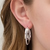 Thumbnail Image 2 of 1/10 CT. T.W. Diamond Triple Oval Hoop Earrings in Sterling Silver