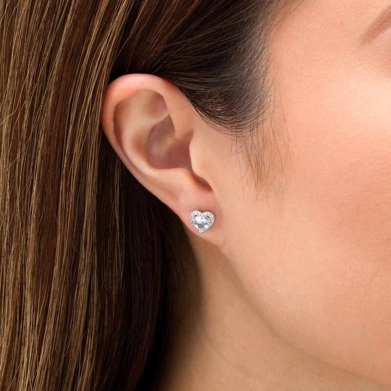 Main Image 2 of 5.0mm Aquamarine and 1/8 CT. T.W. Diamond Frame Heart Stud Earrings in 10K White Gold