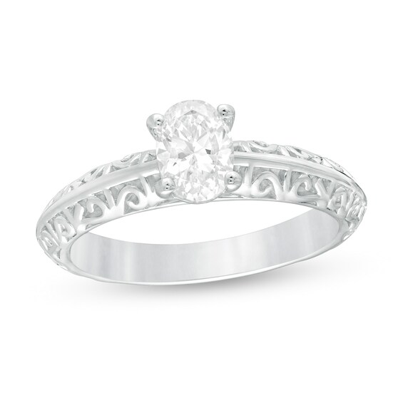 3/4 CT. Certified Oval Diamond Solitaire Filigree Engagement Ring in 14K White Gold (I/SI2) 3/4 CT. Certified Oval Diamond Solitaire Filigree Engagement Ring in 14K White Gold (I/SI2)