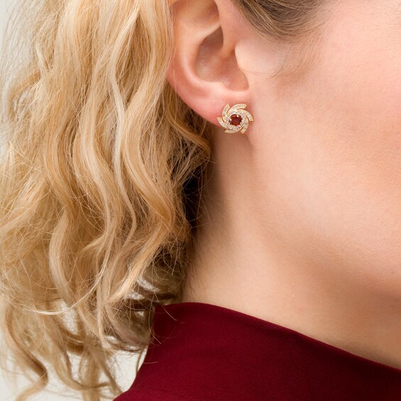 4.0mm Garnet and White Sapphire Pinwheel Frame Stud Earrings in 10K Gold 4.0mm Garnet and White Sapphire Pinwheel Frame Stud Earrings in 10K Gold