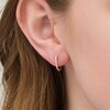 Thumbnail Image 2 of 1/10 CT. T.W. Diamond Huggie Hoop Earrings in 10K Rose Gold