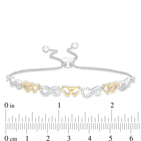 1/20 CT. T.W. Diamond Infinity and Double Heart Bolo Bracelet in Sterling Silver and 10K Gold - 9.5" 1/20 CT. T.W. Diamond Infinity and Double Heart Bolo Bracelet in Sterling Silver and 10K Gold - 9.5"