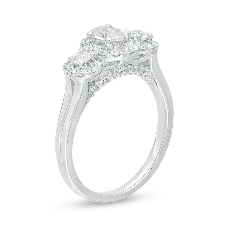 Celebration Ideal 1 CT. T.W. Oval Diamond Frame Three Stone Engagement Ring in 14K White Gold (I/I1)