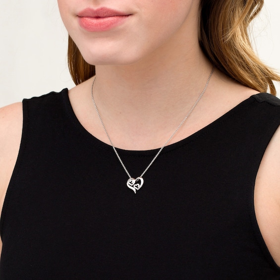 1/10 CT. T.w. Diamond Triple Swirl Heart Pendant in Sterling Silver