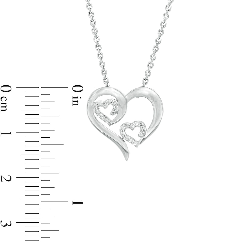 1/10 CT. T.W. Diamond Triple Swirl Heart Pendant in Sterling Silver