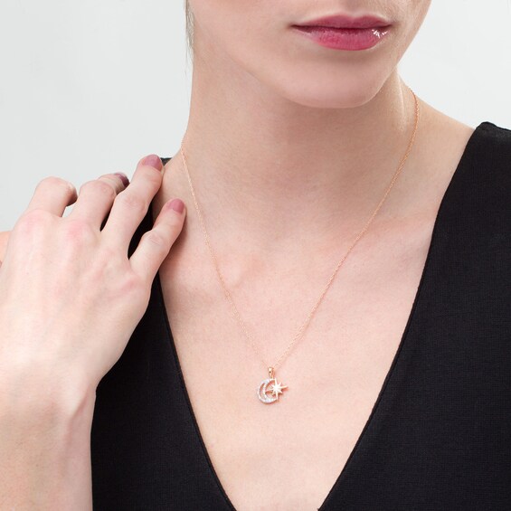 1/15 CT. T.W. Diamond Star and Moon Pendant in Sterling Silver with 10K Rose Gold Plate 1/15 CT. T.W. Diamond Star and Moon Pendant in Sterling Silver with 10K Rose Gold Plate
