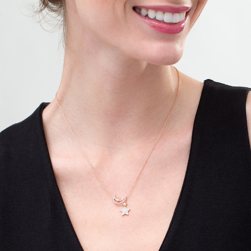 1/15 CT. T.W. Diamond Star and Moon Drop Necklace in Sterling Silver with 10K Rose Gold Plate