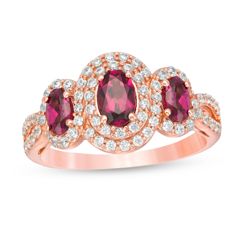 Oval Rhodolite Garnet and 1/2 CT. T.W. Diamond Frame Three Stone Engagement Ring in 14K Rose Gold