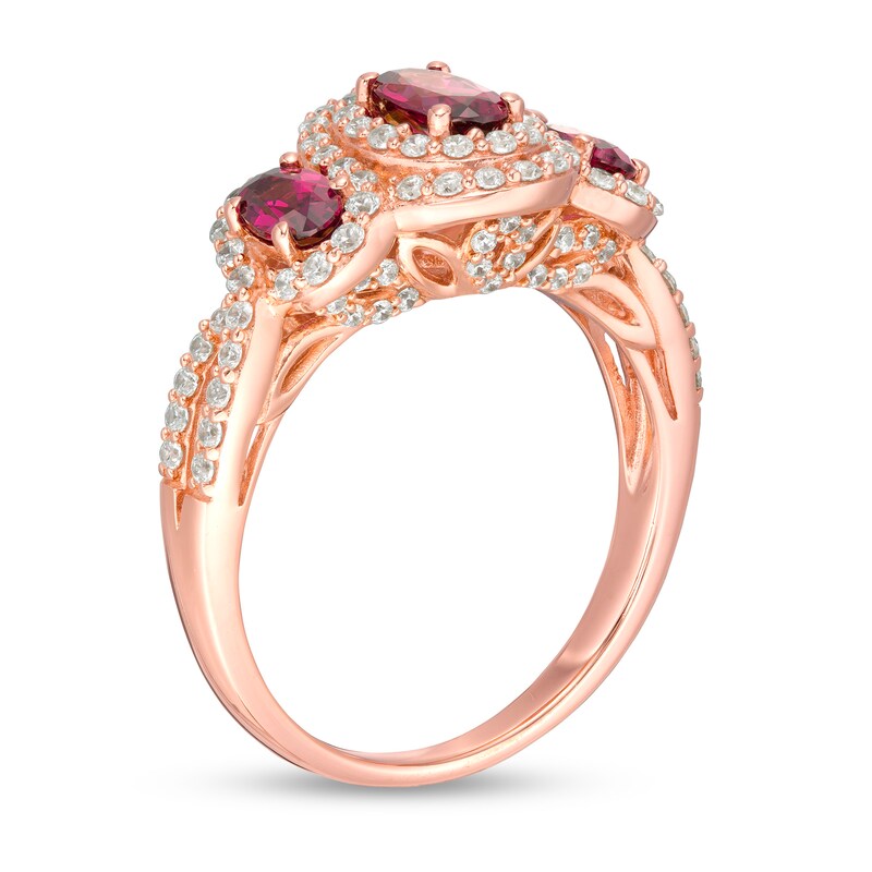 Oval Rhodolite Garnet and 1/2 CT. T.W. Diamond Frame Three Stone Engagement Ring in 14K Rose Gold