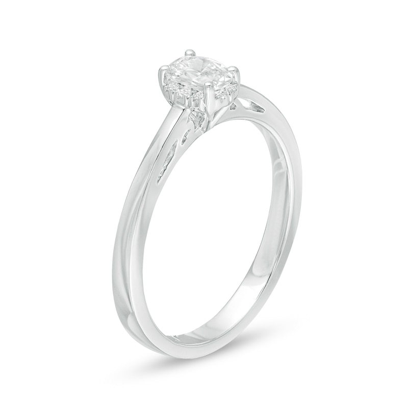 Celebration Ideal 1/3 CT. T.W. Oval Diamond Frame Engagement Ring in 14K White Gold (I/I1)