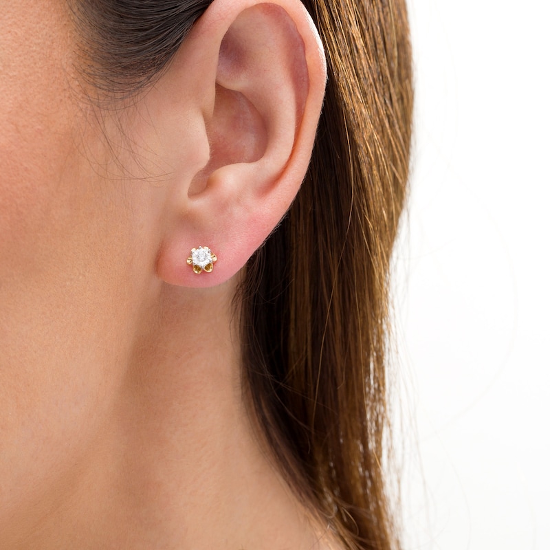 Main Image 2 of 1/15 CT. T.W. Diamond Solitaire Flower Stud Earrings in Sterling Silver with 14K Gold Plate