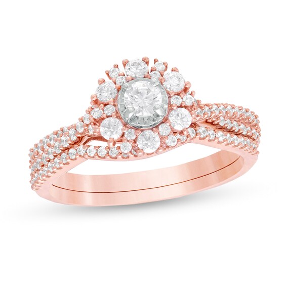 3/4 CT. T.W. Diamond Starburst Frame Twist Shank Bridal Set in 10K Rose Gold 3/4 CT. T.W. Diamond Starburst Frame Twist Shank Bridal Set in 10K Rose Gold