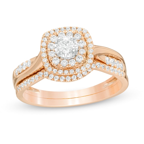 1/2 CT. T.W. Composite Diamond Double Cushion Frame Twist Shank Bridal Set in 10K Rose Gold 1/2 CT. T.W. Composite Diamond Double Cushion Frame Twist Shank Bridal Set in 10K Rose Gold