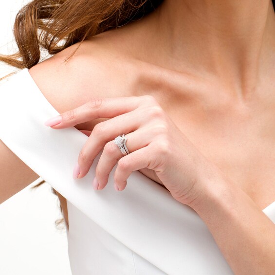 1/6 CT. T.w. Composite Diamond Pear-Shaped Frame Heart-Sides Bridal Set in Sterling Silver