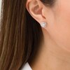3/8 CT. T.W. Composite Diamond Swirl Stud Earrings in 10K White Gold
