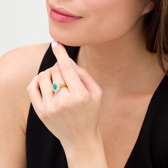 Oval Emerald and 1/5 CT. T.W. Diamond Flower Frame Split Shank Ring in 10K Gold Oval Emerald and 1/5 CT. T.W. Diamond Flower Frame Split Shank Ring in 10K Gold