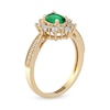 Thumbnail Image 1 of Oval Emerald and 1/10 CT. T.W. Diamond Sunburst Frame Vintage-Style Tapered Shank Ring in 10K Gold