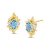 Oval Lab-Created Blue Zircon and Diamond Accent Flame Stud Earrings in 10K Gold