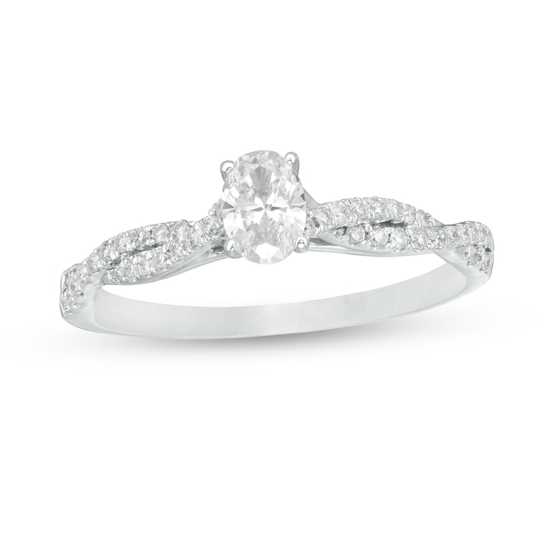 Main Image 1 of 1/2 CT. T.W. Oval Diamond Twist Engagement Ring in 14K White Gold
