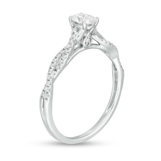 1/2 CT. T.w. Oval Diamond Twist Engagement Ring in 14K White Gold