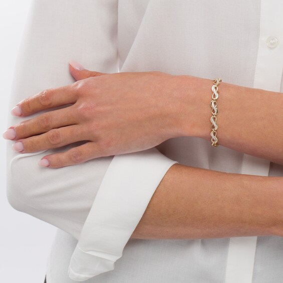 1/4 CT. T.w. Diamond Infinity Link Bracelet in 10K Gold