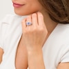 Emerald-Cut Tanzanite and 1/3 CT. T.W. Diamond Frame Three Stone Split Shank Engagement Ring in 14K White Gold