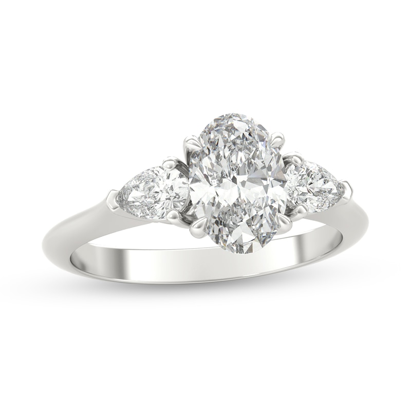 1-1/3 CT. T.W. Oval and Pear-Shaped Diamond Three Stone Engagement Ring in Platinum