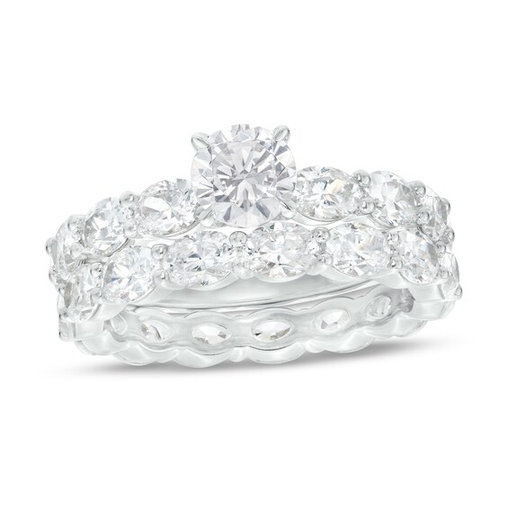 2 CT. T.W. Oval and Round Diamond Bridal Set in Platinum 2 CT. T.W. Oval and Round Diamond Bridal Set in Platinum