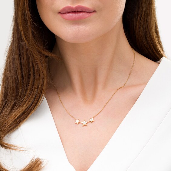 1/6 CT. T.W. Diamond Three Stone Triple Star Necklace in Sterling Silver with 18K Gold Plate 1/6 CT. T.W. Diamond Three Stone Triple Star Necklace in Sterling Silver with 18K Gold Plate