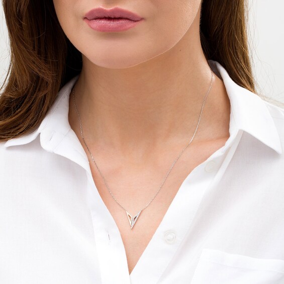 Wonder Womanâ¢ Collection 1/10 CT. T.w. Diamond "Bracelets of Submission" Necklace in Sterling Silver and 10K Gold