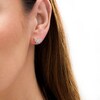 Thumbnail Image 2 of Wonder Woman™ Collection 1/8 CT. T.W. Diamond Symbol Stud Earrings in 10K Gold