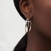 Thumbnail Image 1 of Diamond-Cut Cross Dangle Hoop Earrings in 10K Gold