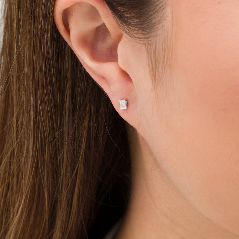 Main Image 2 of 1/4 CT. T.W. Emerald-Cut Diamond Solitaire Stud Earrings in 10K White Gold (I/I2)