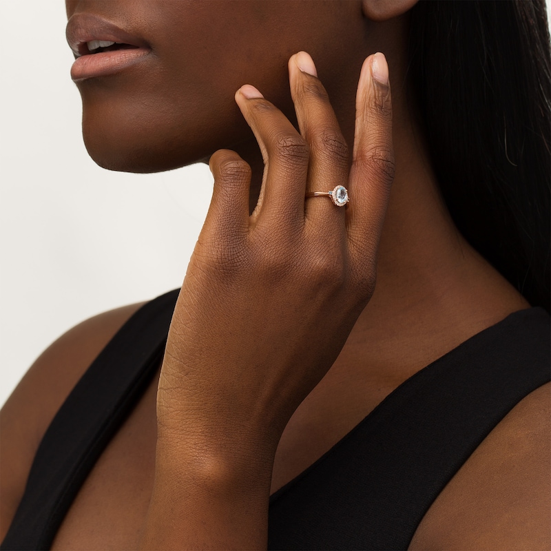 Main Image 2 of Cherished Promise Collection™ Blue Topaz and 1/20 CT. T.W. Diamond Oval Frame Promise Ring in 10K Rose Gold