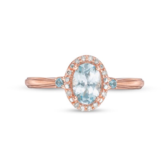 Cherished Promise Collectionâ¢ Blue Topaz and 1/20 CT. T.w. Diamond Oval Frame Promise Ring in 10K Rose Gold